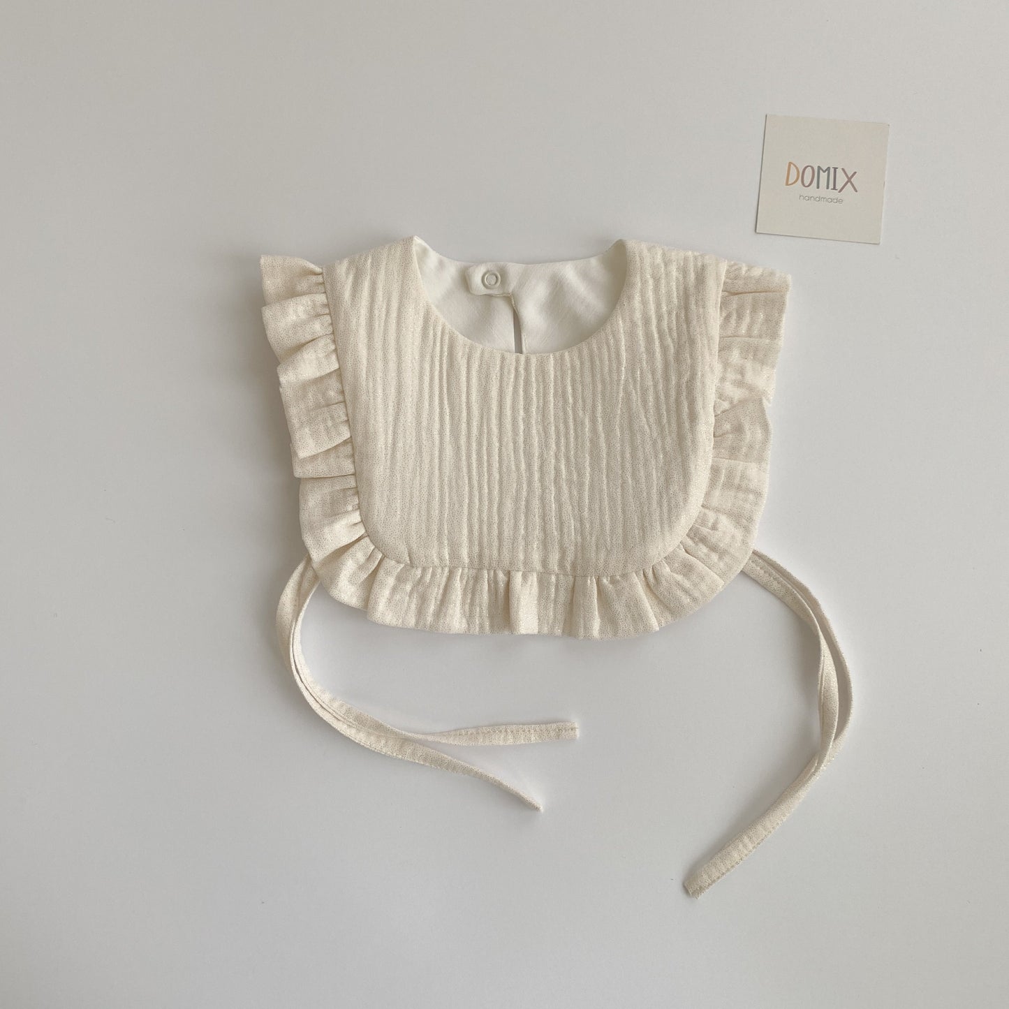 Shimmer Frill Bib